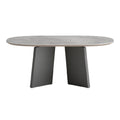 Eettafel met ovalen blad van natuursteen en moderne zwarte basis