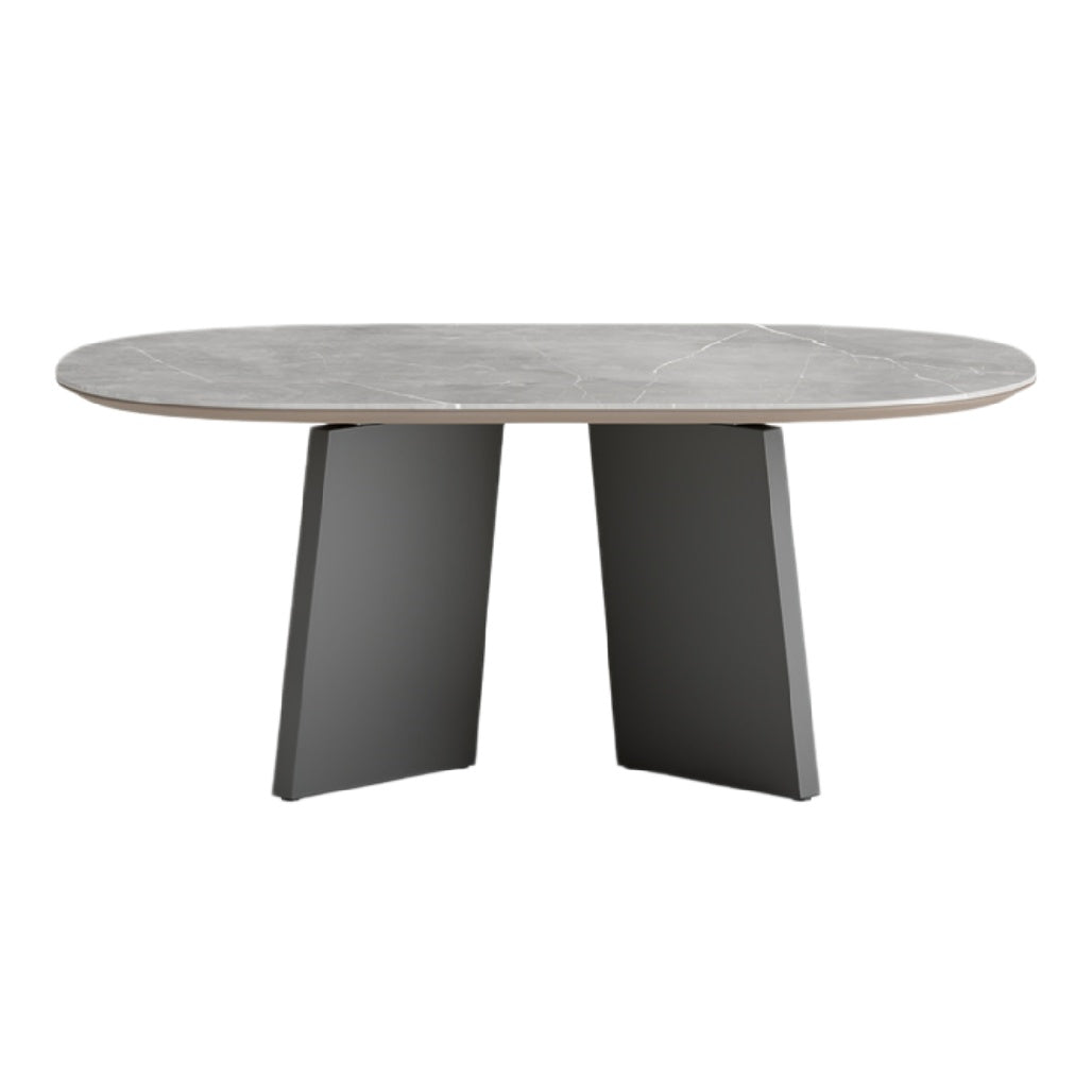 Eettafel met ovalen blad van natuursteen en moderne zwarte basis